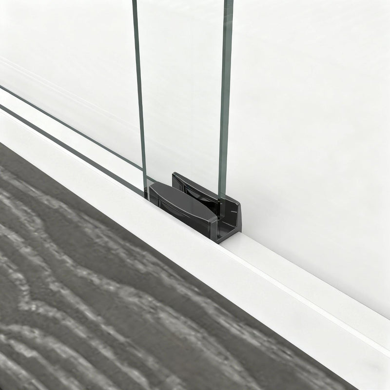 Bottom track and black seal detail on a tempered glass shower door