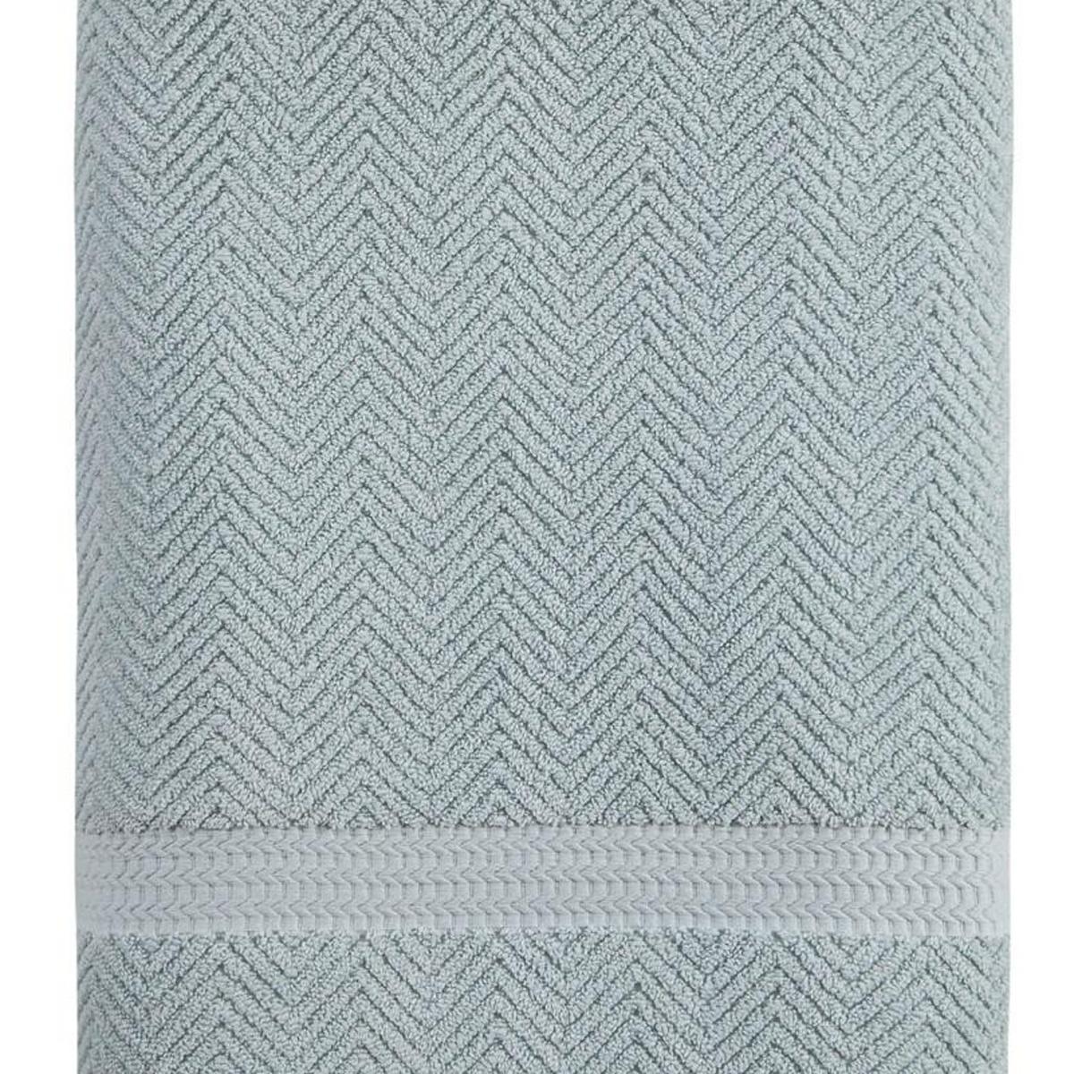 Light blue Turkish cotton bath towel with raised chevron texture and stitched hem