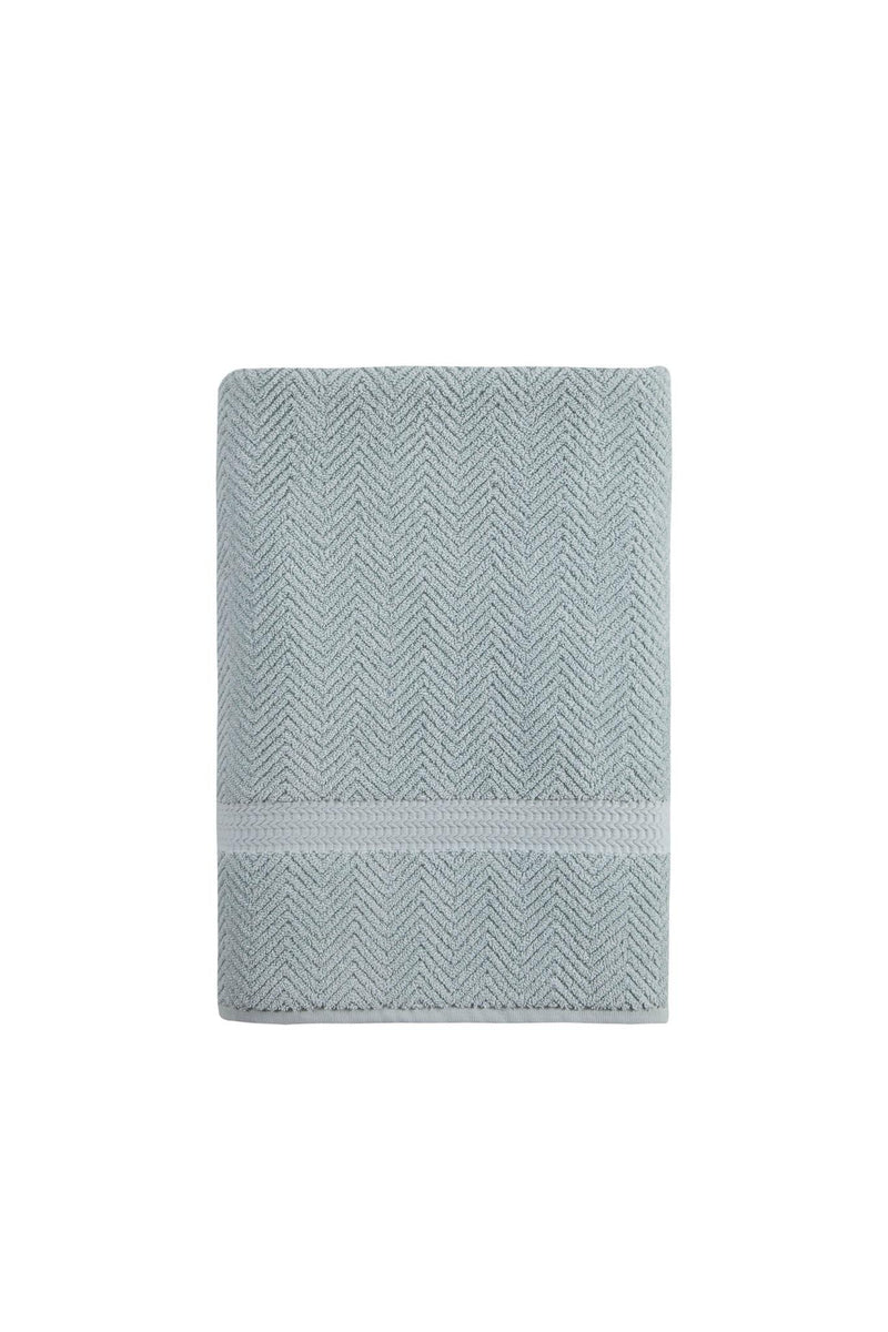 Light blue Turkish cotton bath towel, neatly folded, chevron pattern with band