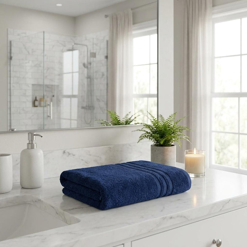 Folded navy terry bath sheet with banded border