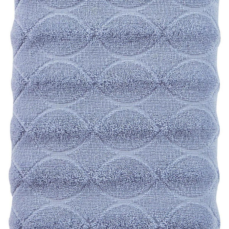 Blue looped jacquard bath towel with raised oval scallop pattern, close-up