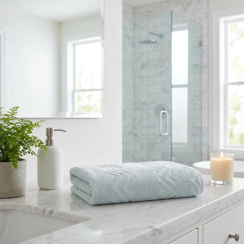 Folded aqua bath sheet with chevron jacquard texture, Turkish cotton