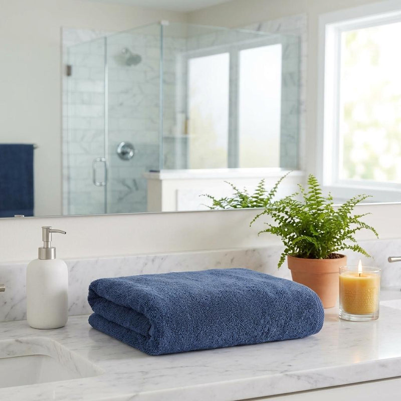 Folded navy blue Turkish cotton bath sheet, plush terry towel