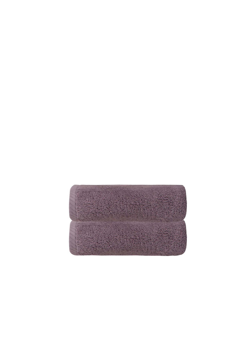 Purple Turkish cotton hand towel, neatly folded with terry loop pile texture