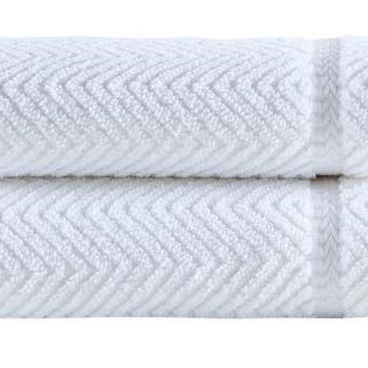 White chevron Turkish cotton towel with raised zigzag pattern, folded edge visible