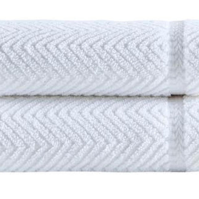 White chevron Turkish cotton towel with raised zigzag pattern, folded edge visible
