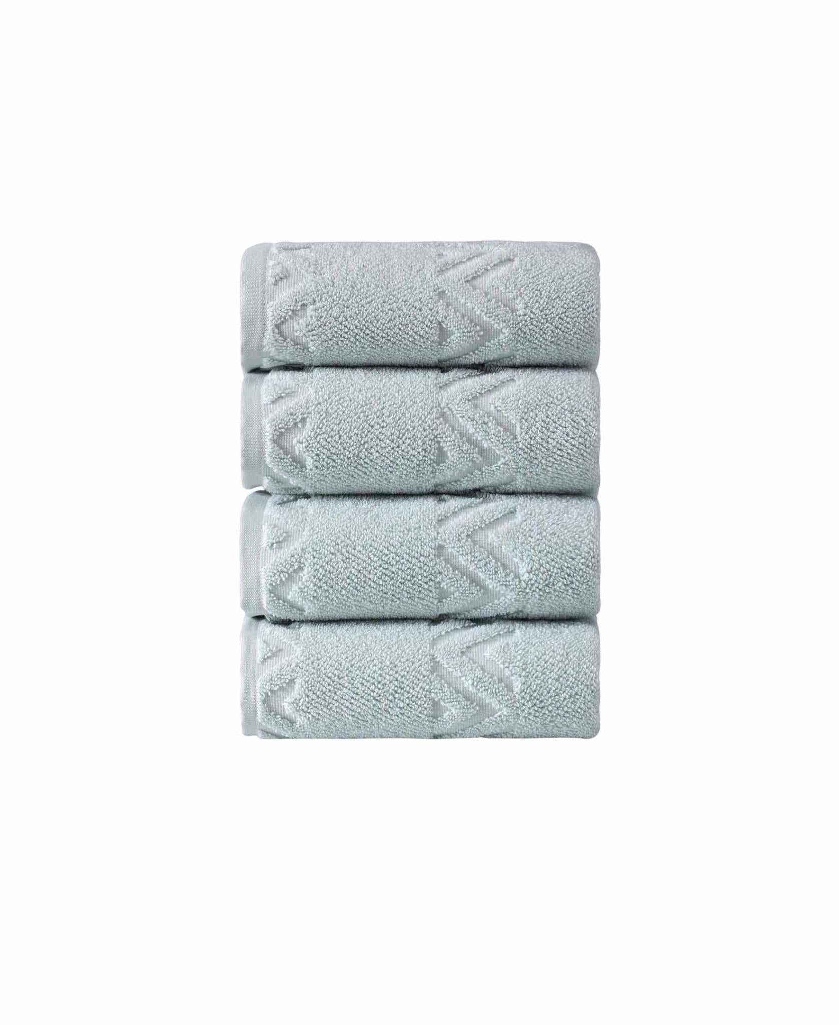 Aqua geometric Turkish cotton hand towels, folded stack with embroidered chevron pattern