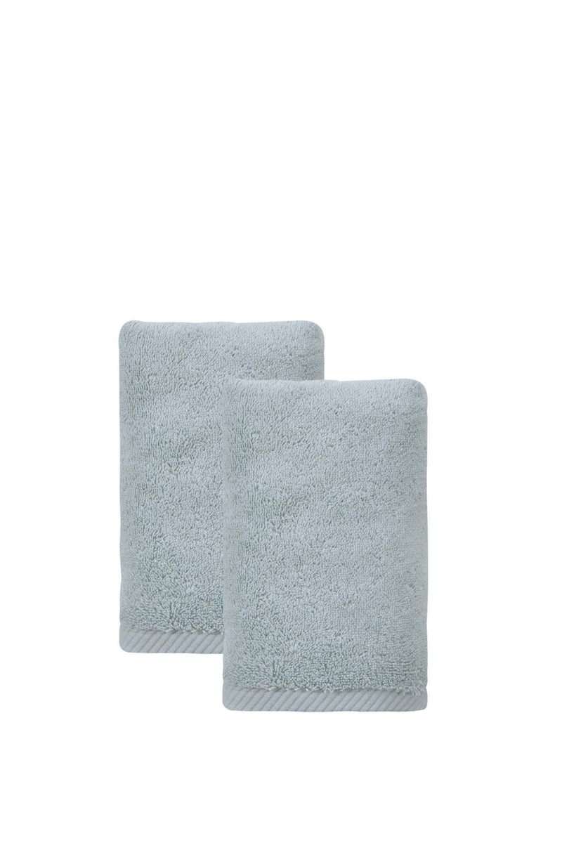 Set of two Turkish cotton hand towels in light aqua blue, folded and stacked