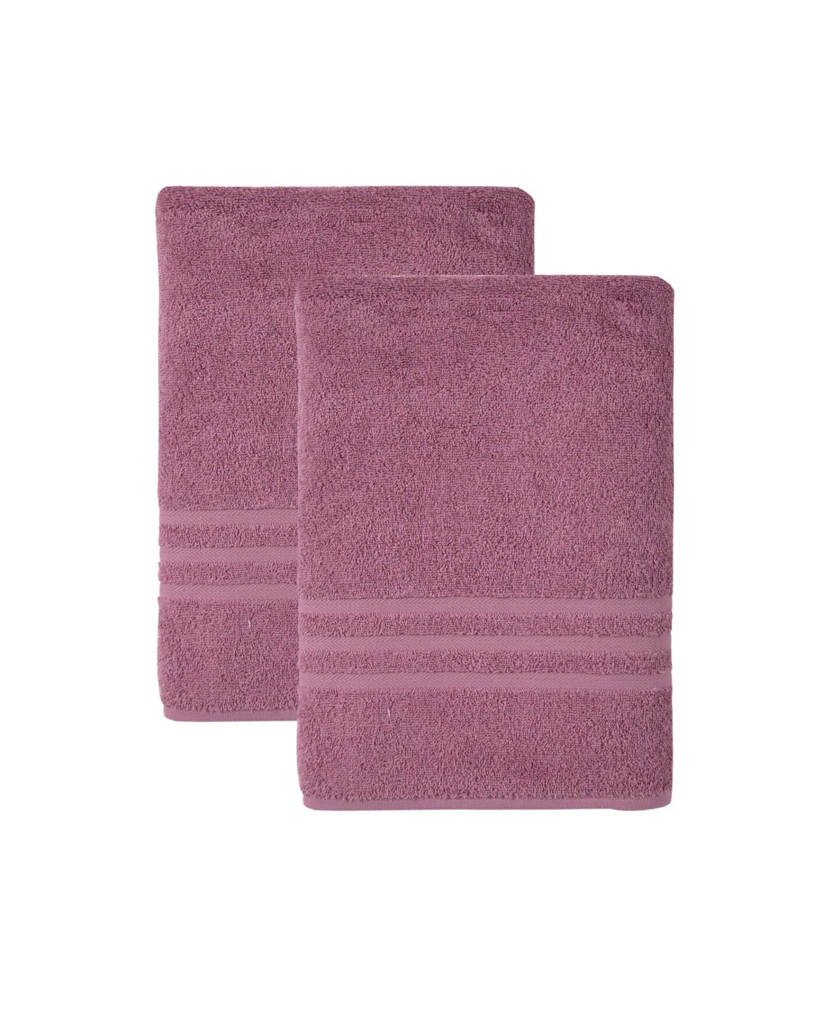 Pair of pink Turkish cotton bath towels, one folded over the other.