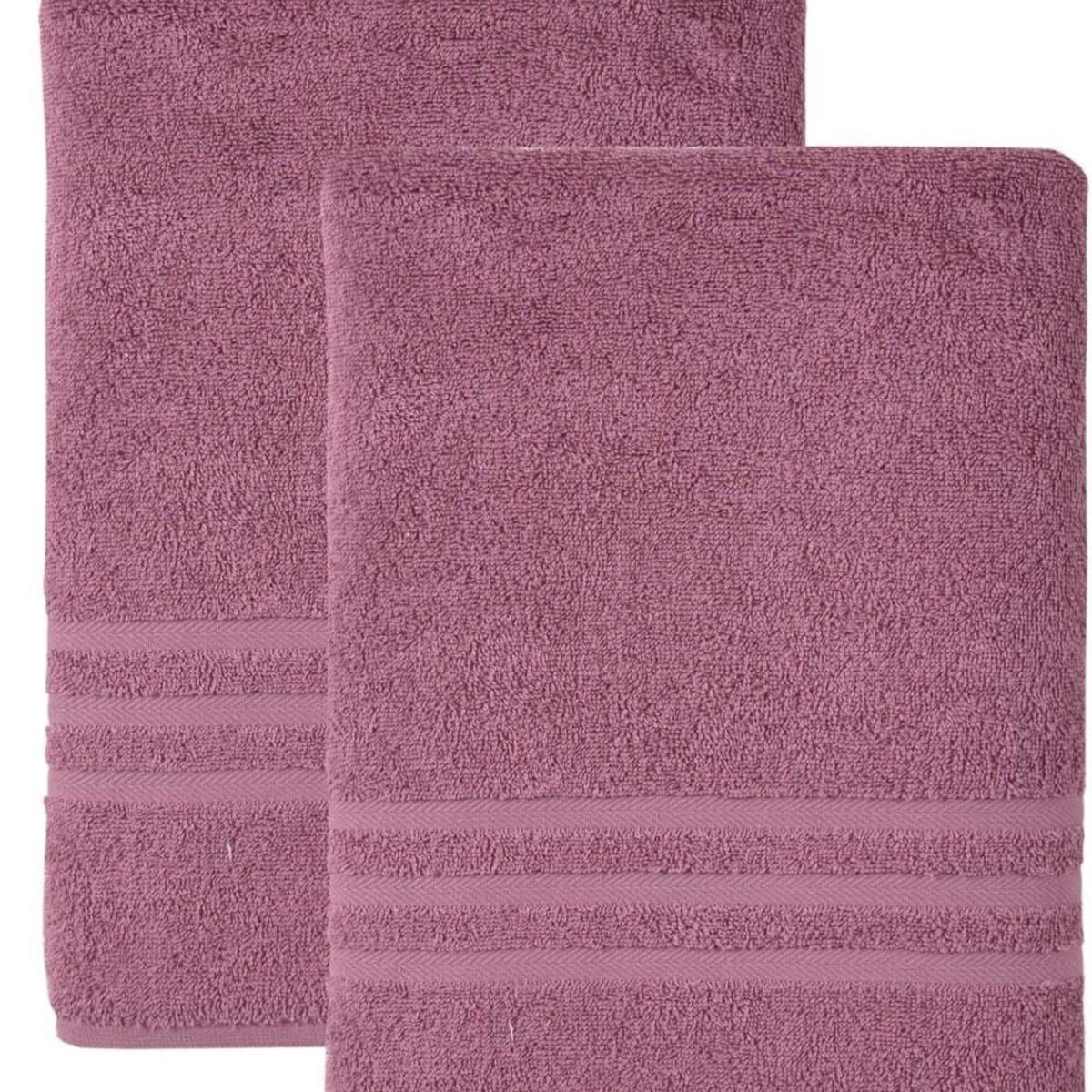 Pink Turkish cotton bath towel set with textured loops and striped trim detail.