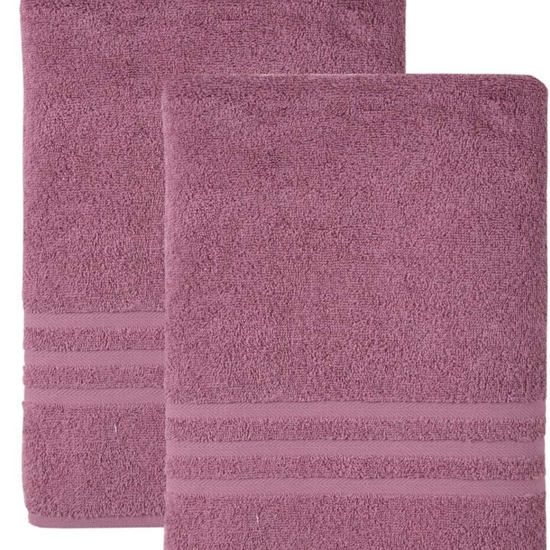 Pink Turkish cotton bath towel set with textured loops and striped trim detail.