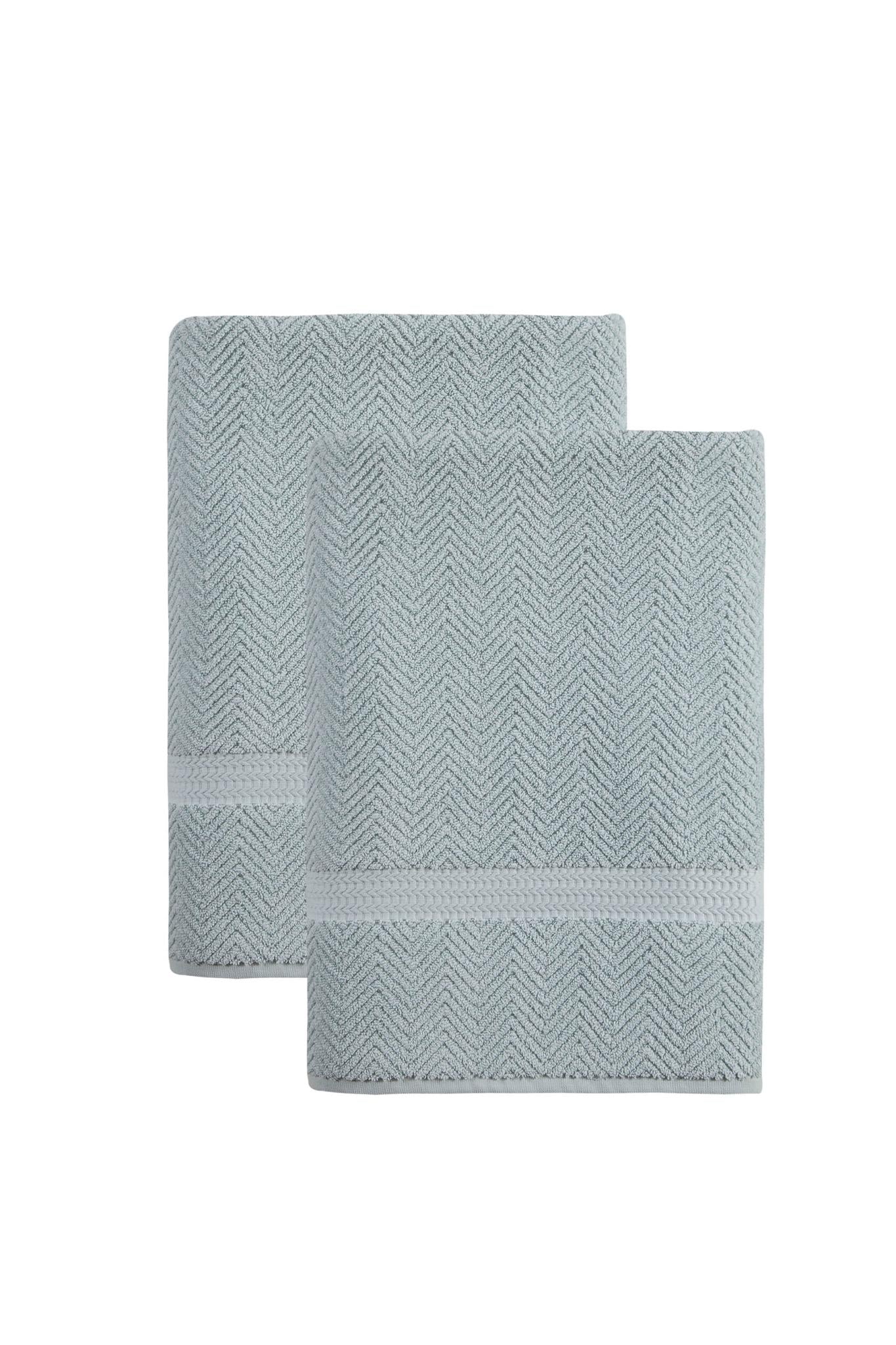 Set of two light blue chevron Turkish cotton bath sheets, folded and stacked