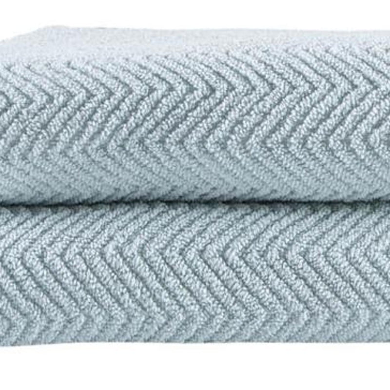 Light blue chevron bath sheet close-up, textured Turkish cotton weave