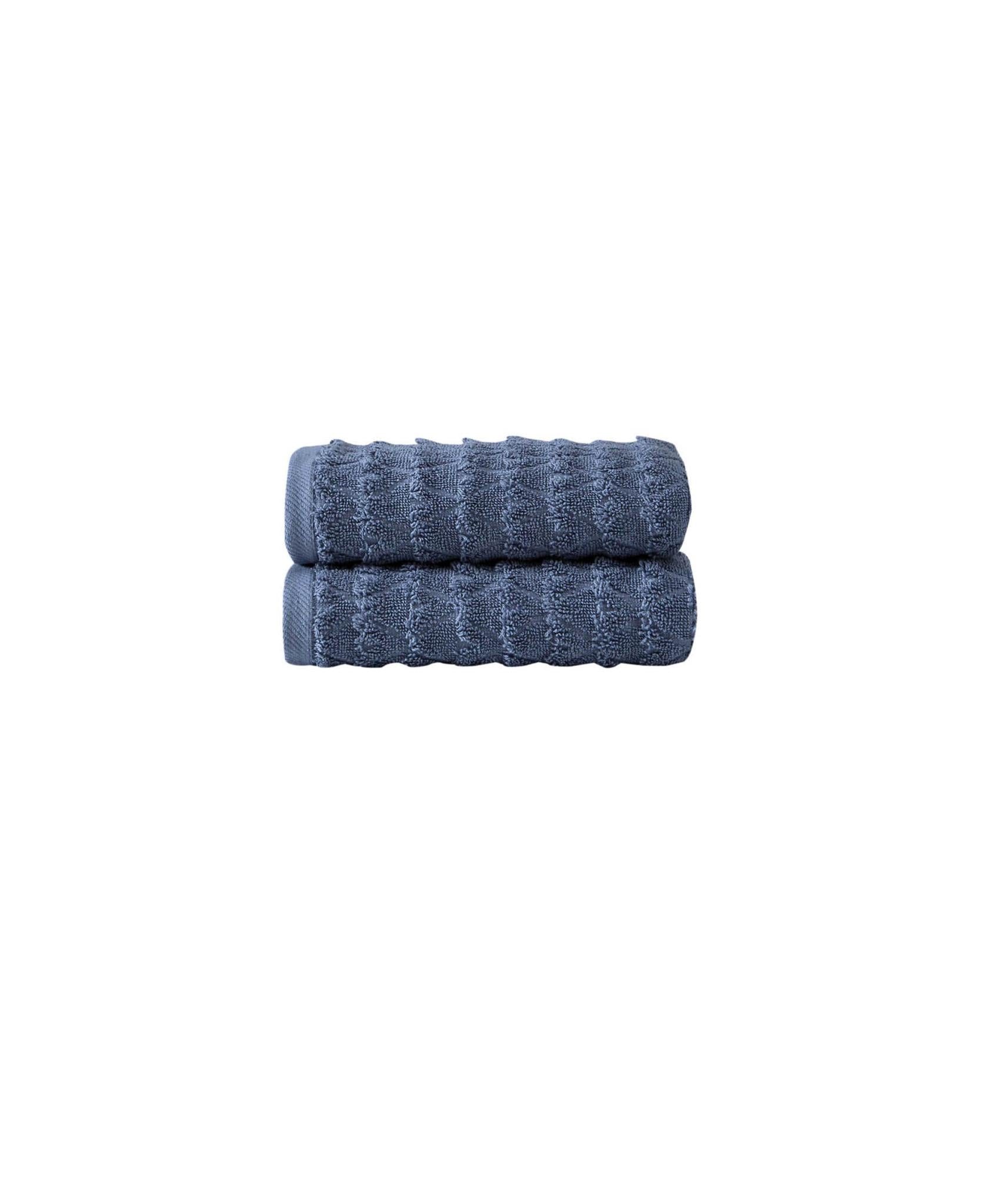 Navy geometric Turkish cotton hand towels, two folded stacks