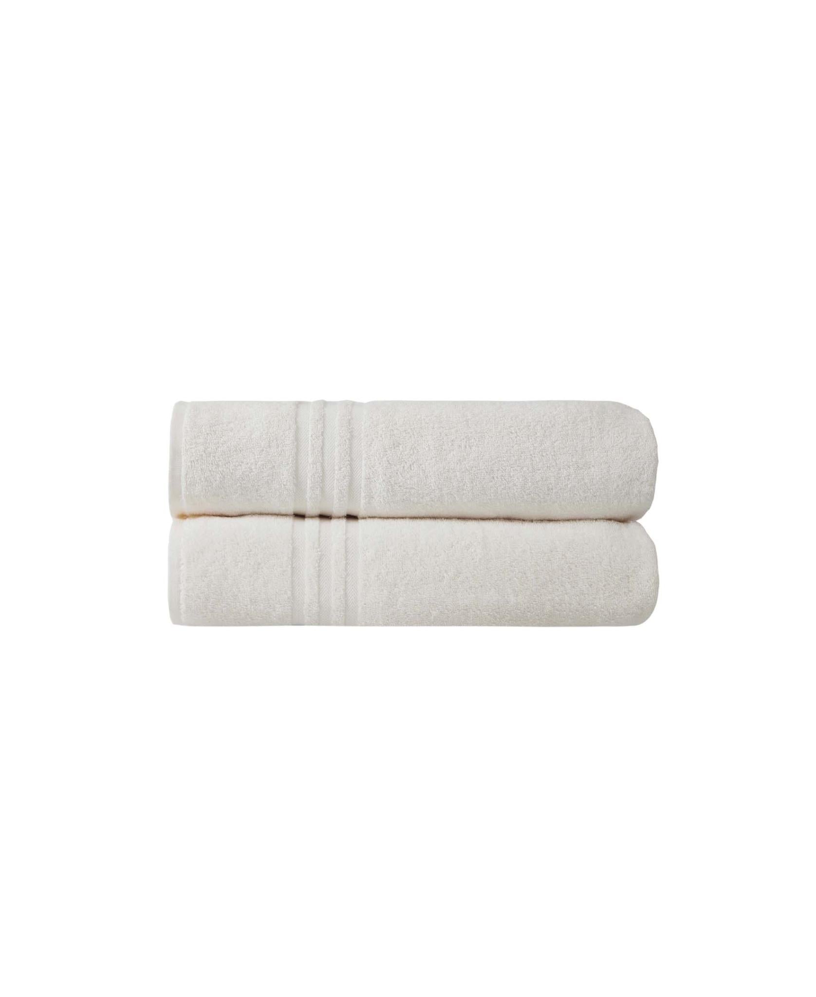 Light beige bath sheet folded with textured terry surface and hemline detail