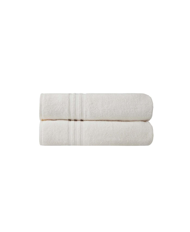Light beige bath sheet folded with textured terry surface and hemline detail