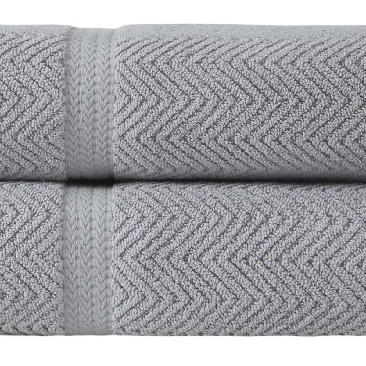 Set of two light gray chevron Turkish cotton bath towels, folded close-up