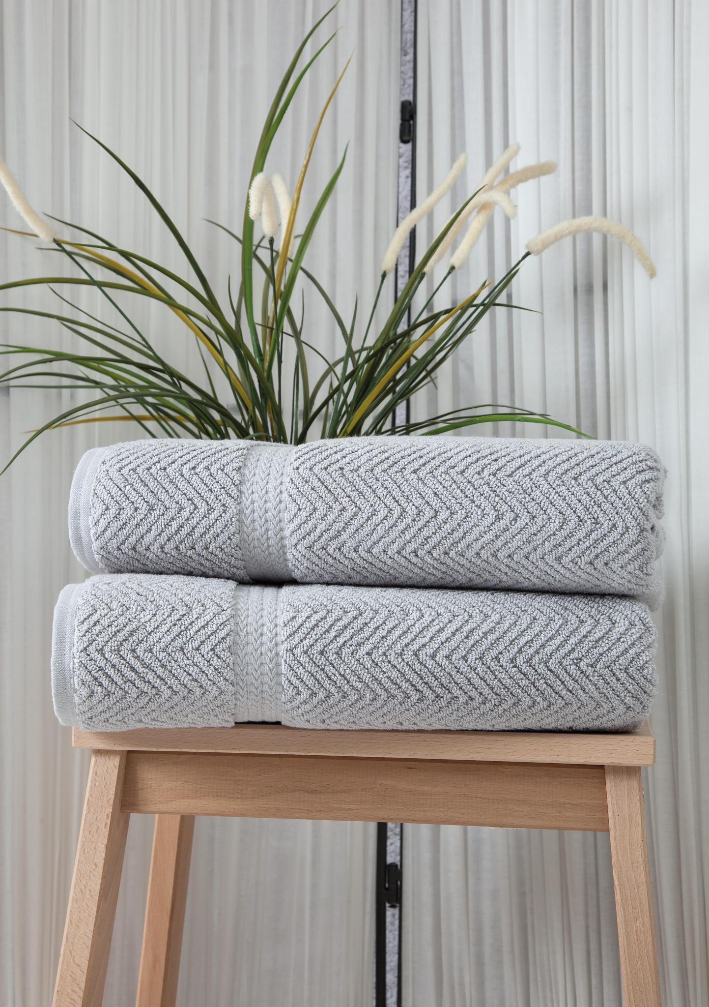 Light gray chevron Turkish cotton bath towels stacked, two-piece set