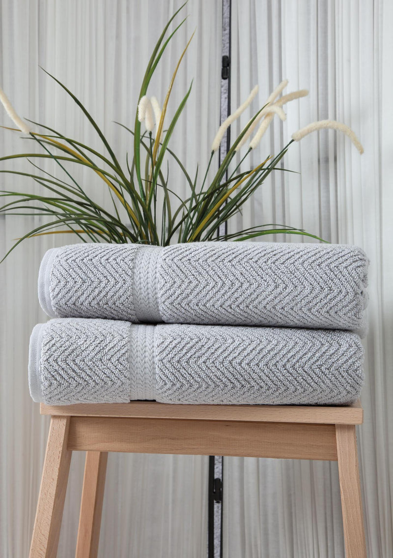 Light gray chevron Turkish cotton bath towels stacked, two-piece set