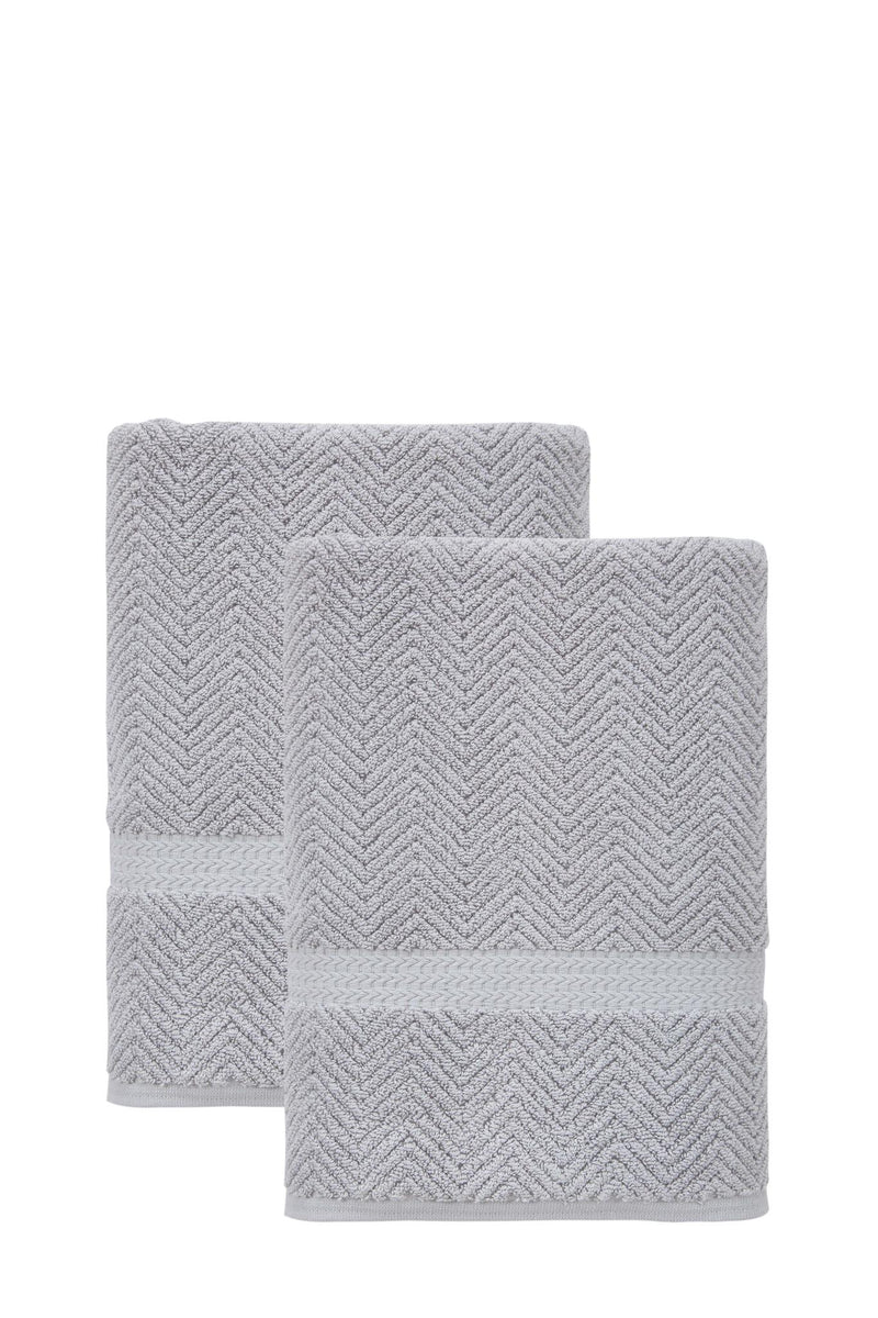 Two light gray chevron Turkish cotton bath towels, folded stack