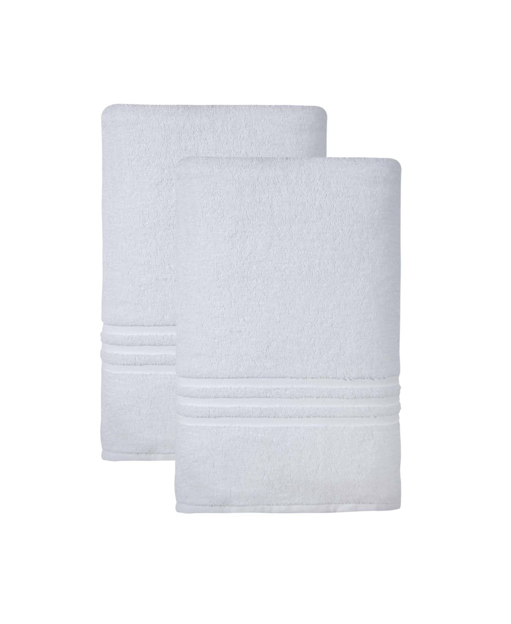 Two white bath sheet towels, overlapping and neatly folded.