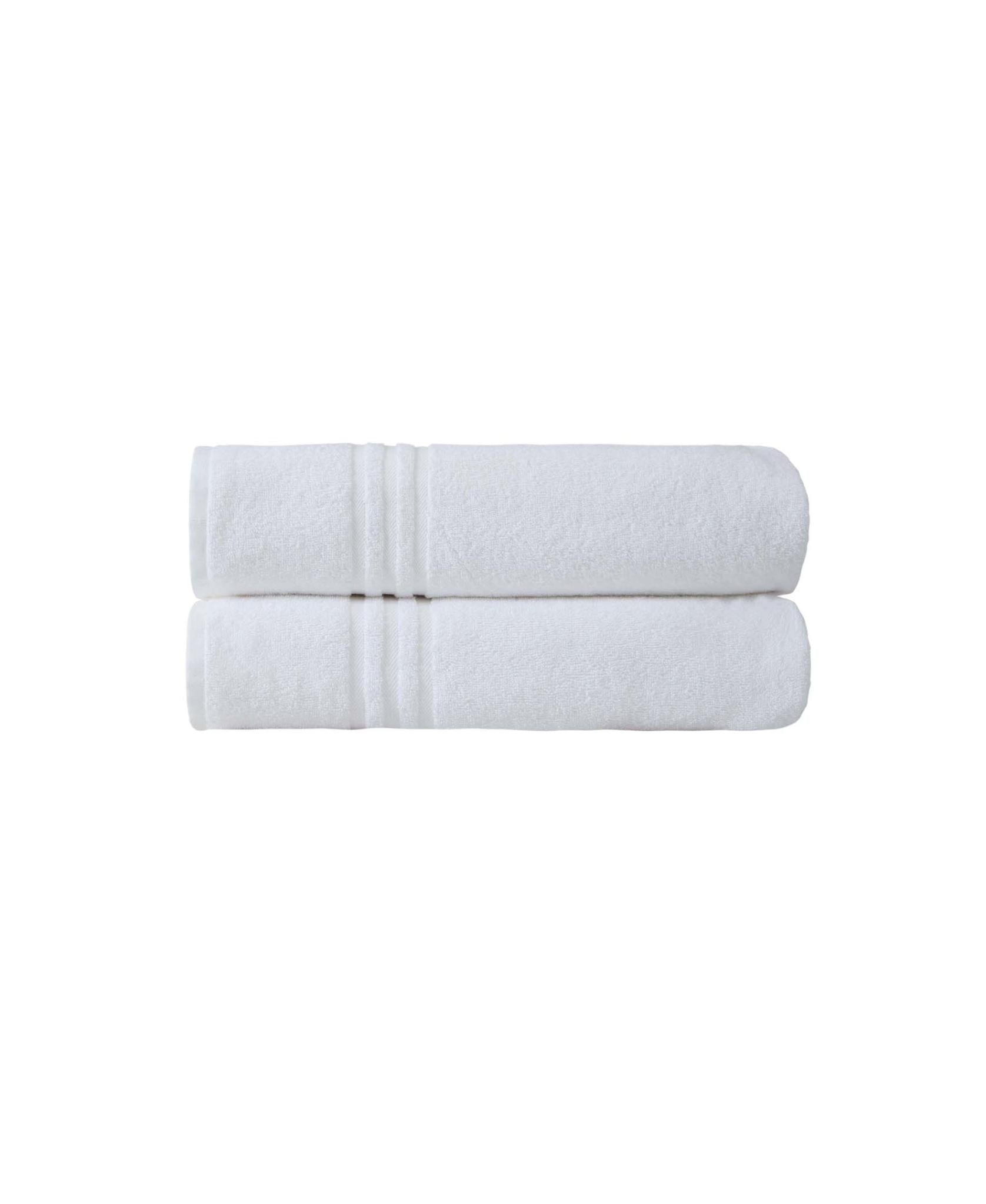 Set of two white bath sheet towels, neatly folded and stacked.