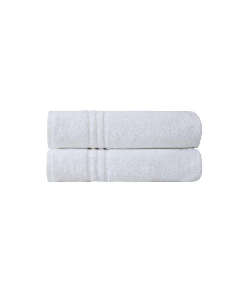 Set of two white bath sheet towels, neatly folded and stacked.