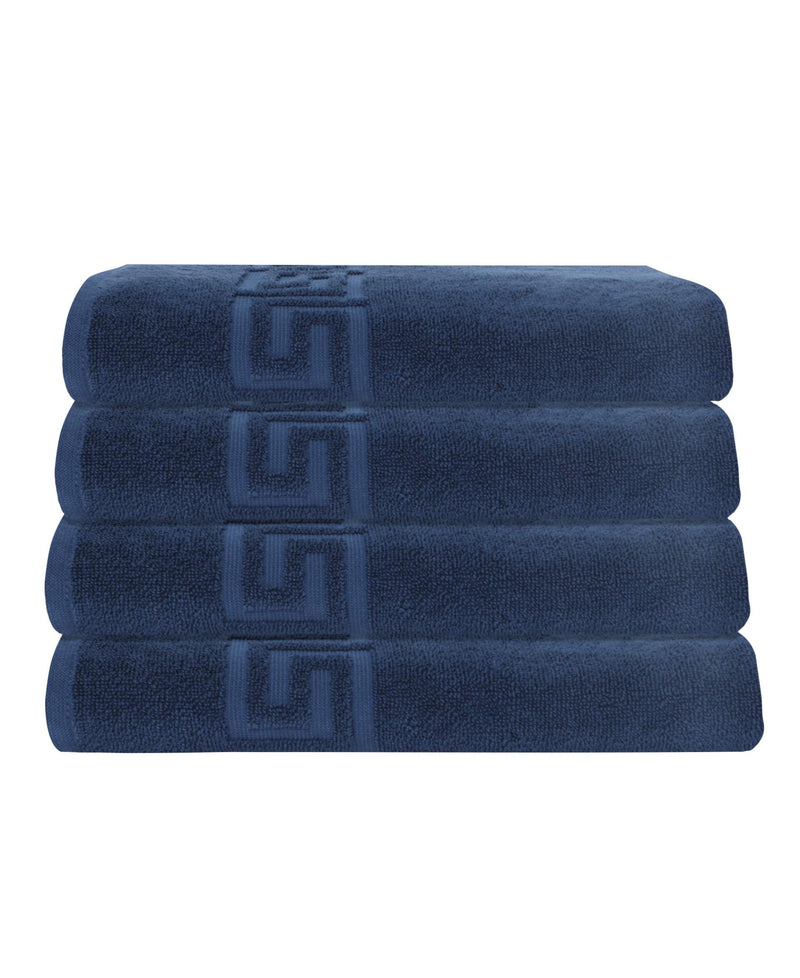 Stack of navy bath towels with Greek key jacquard trim