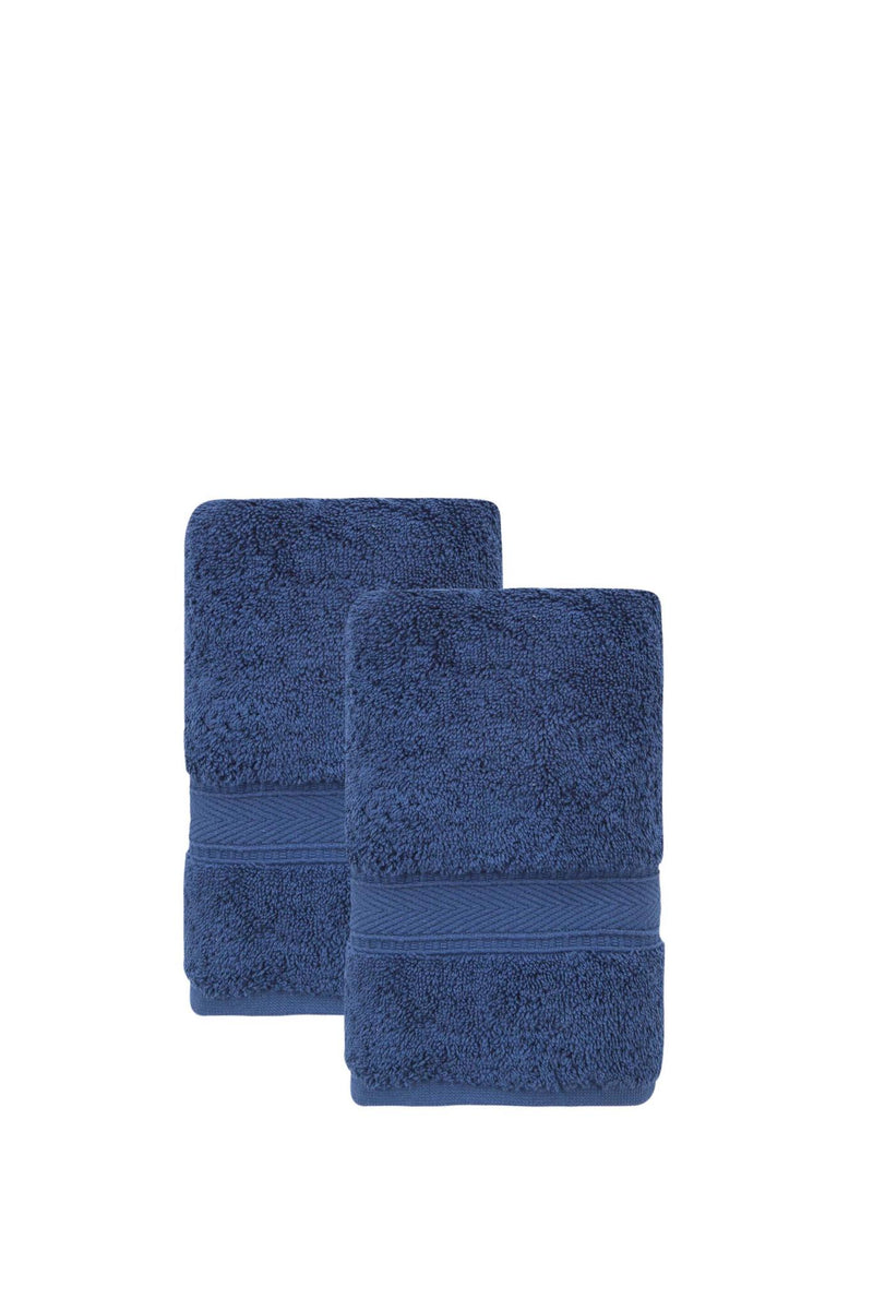 Set of two folded navy hand towels with textured terry loops and stitched bands