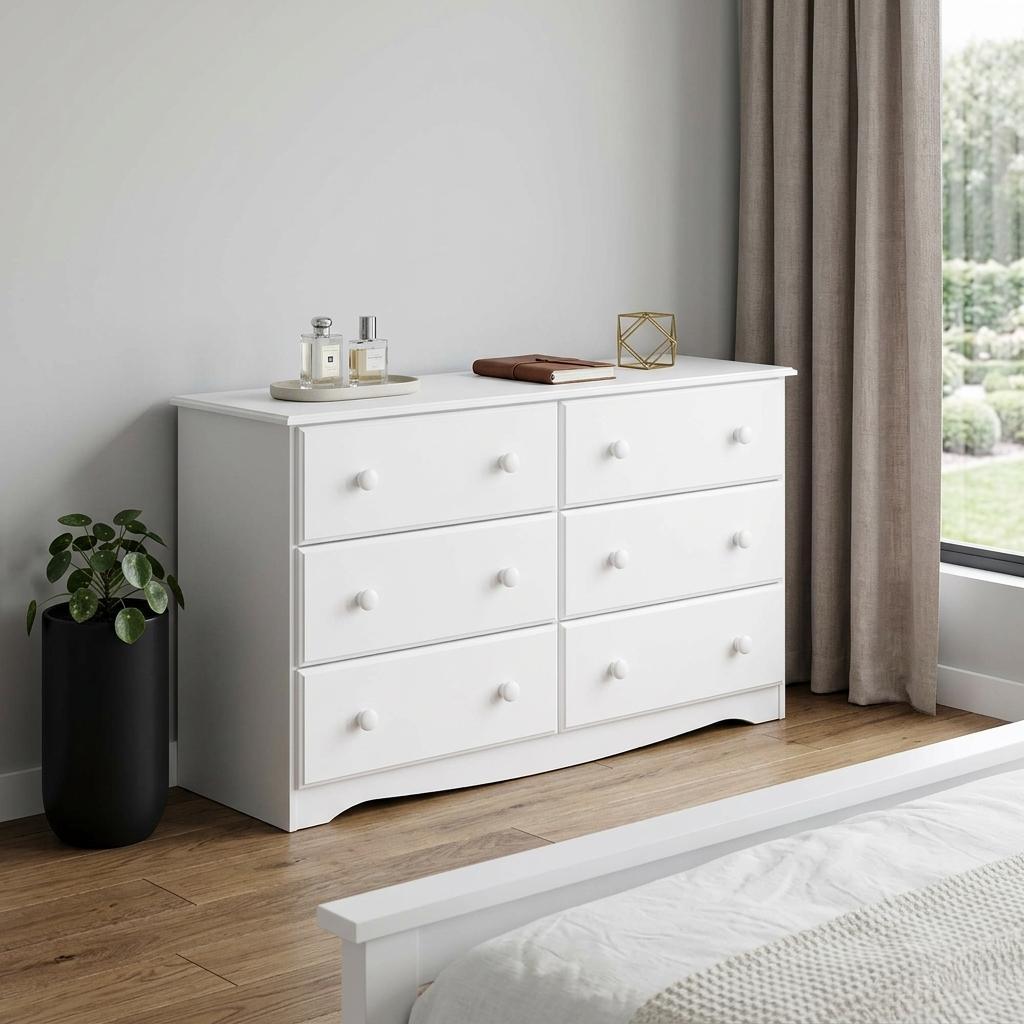 White solid wood six-drawer dresser in living room, round knobs and clean front