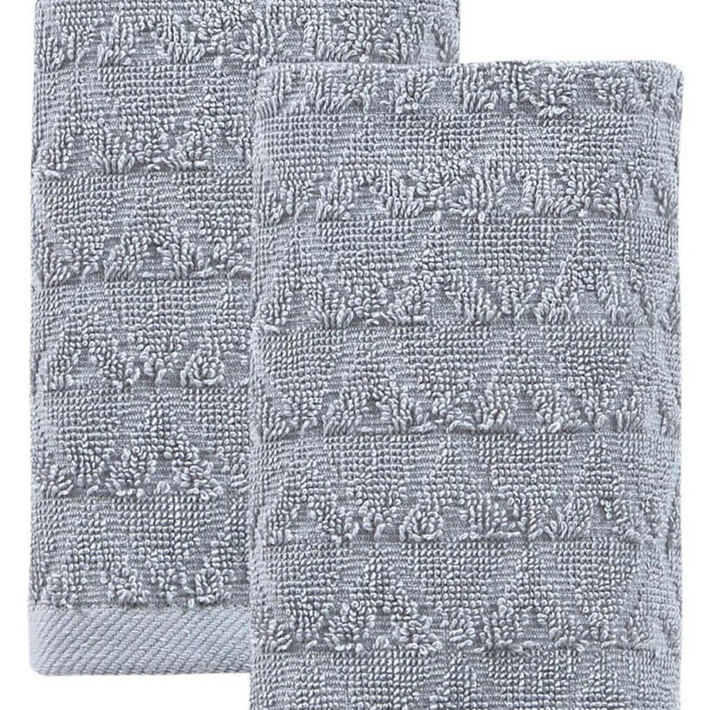 Two light gray textured geometric Turkish cotton hand towels, close-up fabric