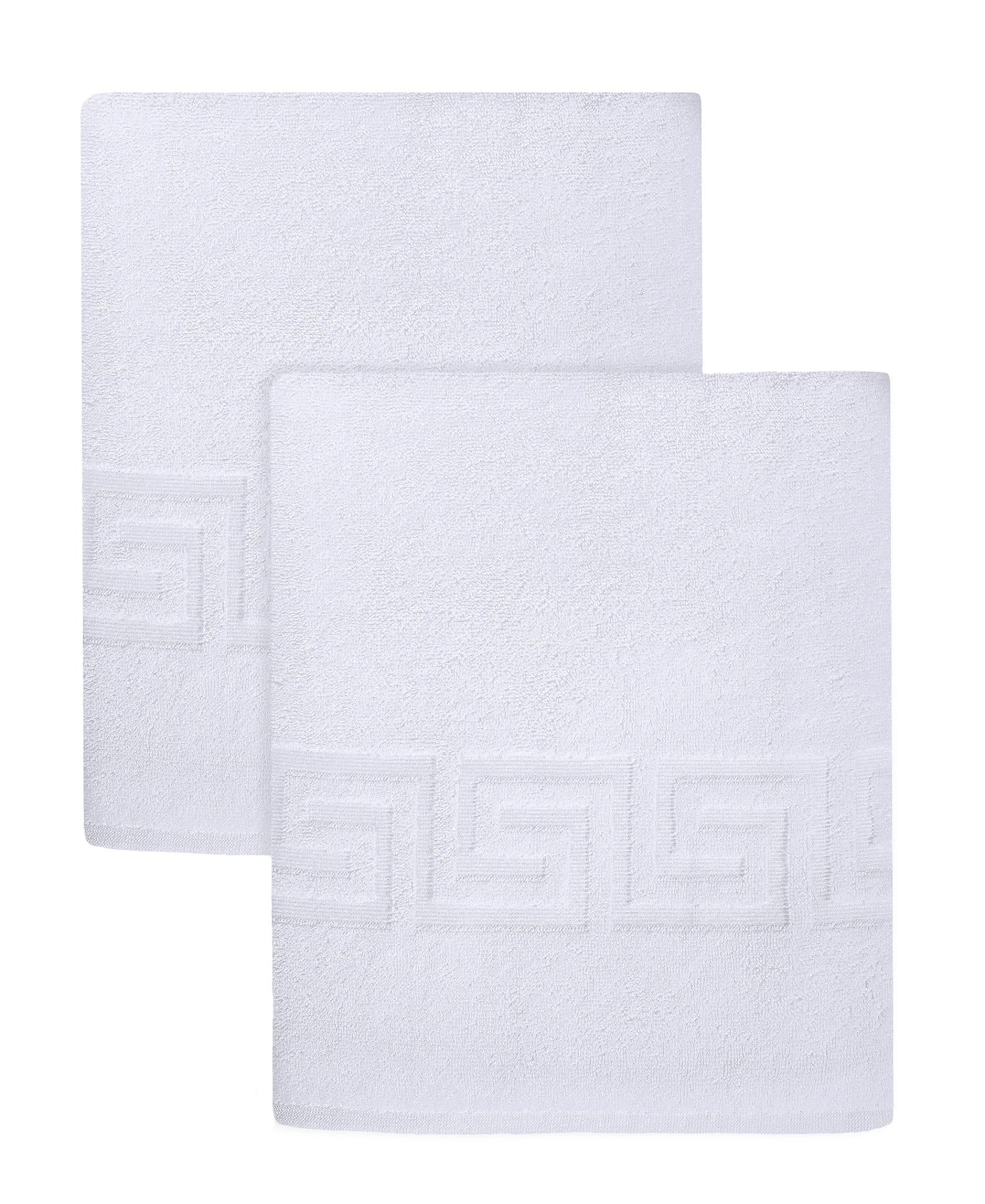 Set of two white Turkish cotton bath sheets with Greek key border, neatly folded