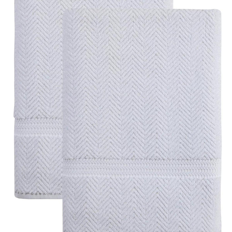 White chevron bath sheet set, close-up of textured zigzag weave and stitched hem
