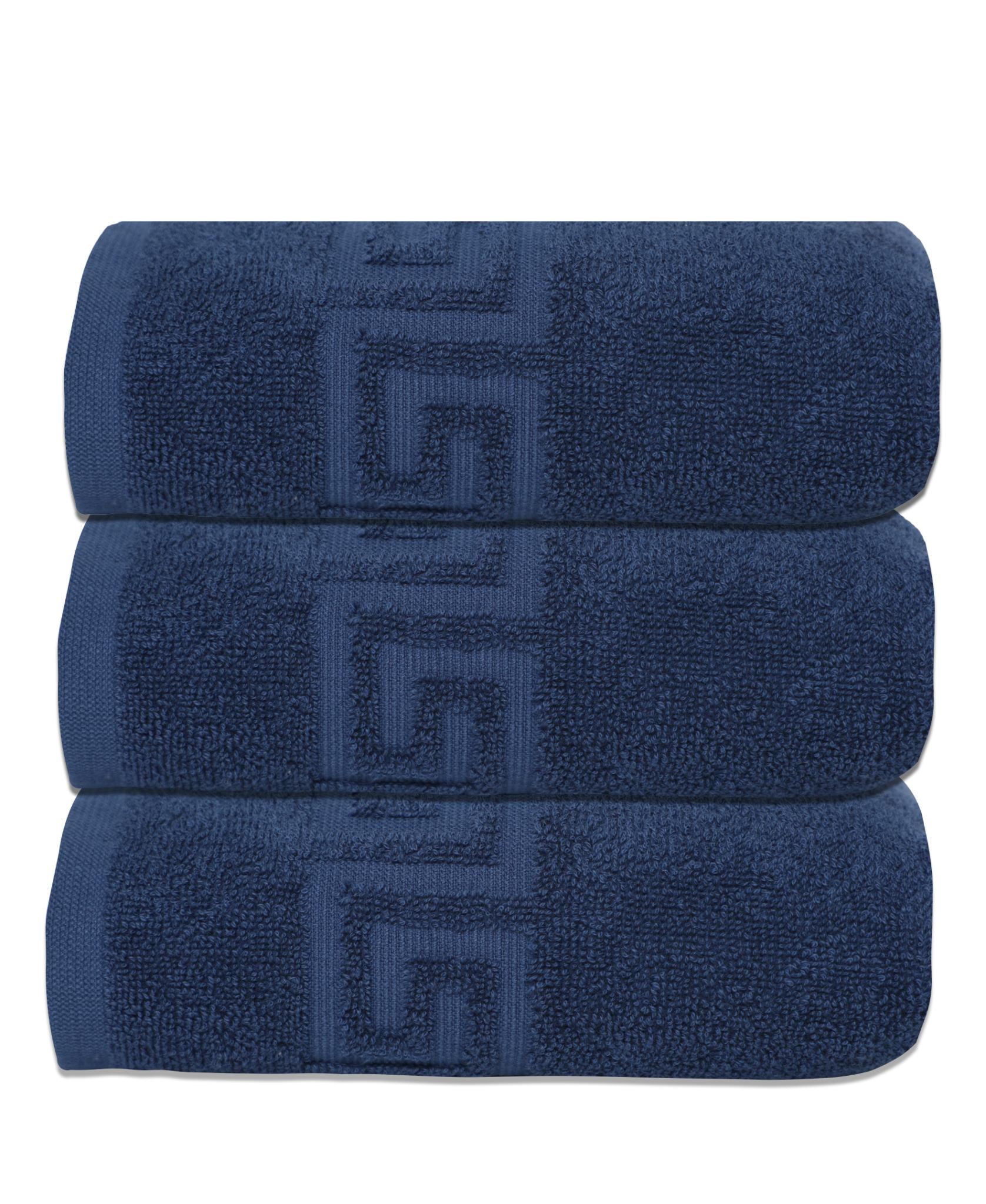 Set of three navy Turkish cotton hand towels stacked, Greek key motif visible