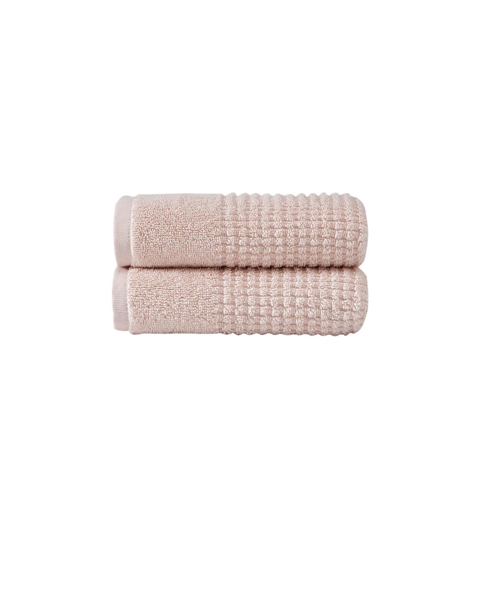 Set of two pink Turkish cotton hand towels, folded with textured waffle weave