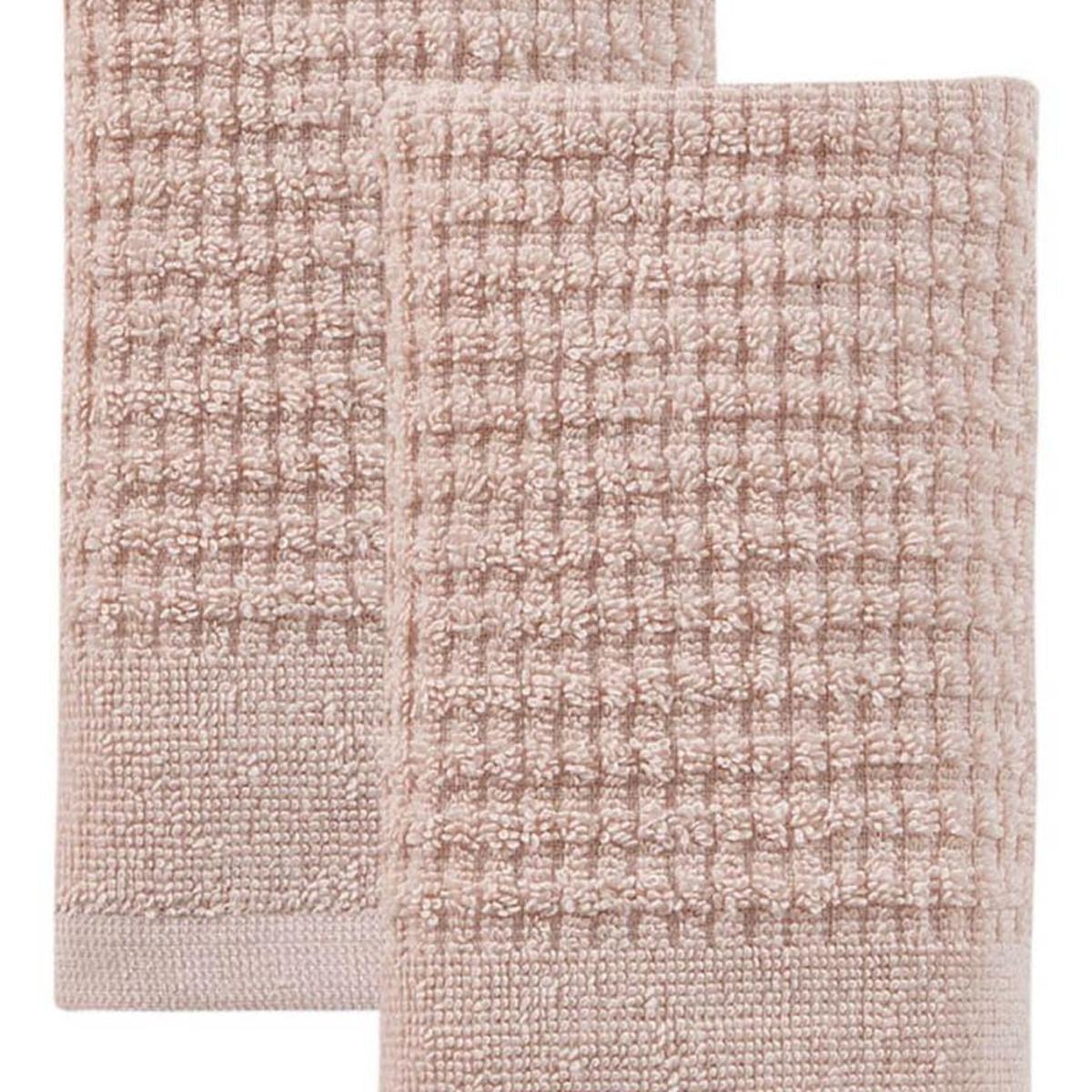 Pink Turkish cotton hand towel with textured waffle weave, close-up of folded fabric