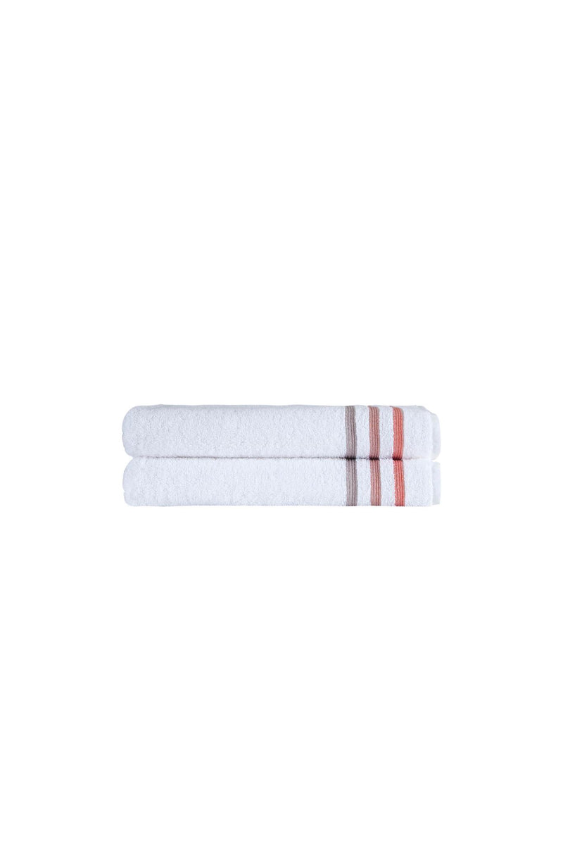 Set of two white Turkish cotton bath towels, folded with tan and coral stripes