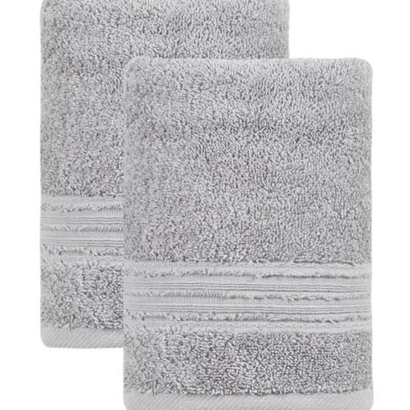 Close-up of light gray Turkish cotton hand towels, textured terry face with striped hem