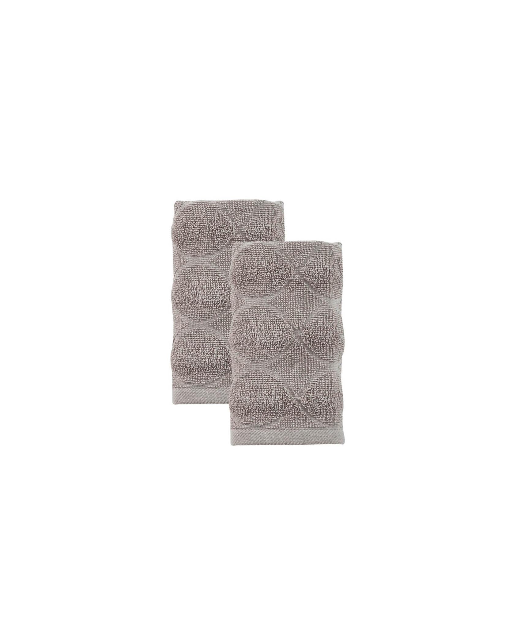 Two taupe Turkish hand towels folded together with raised geometric design