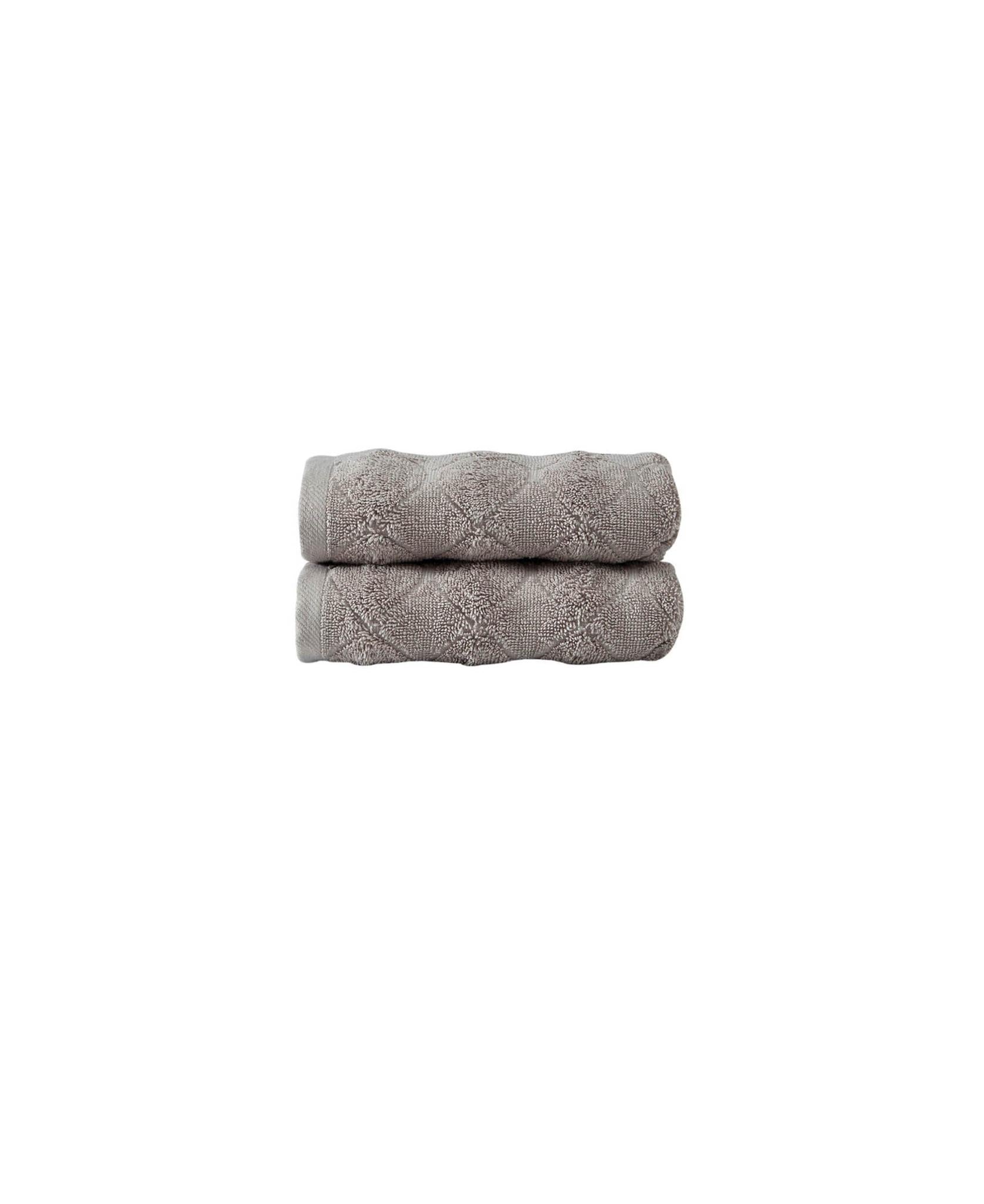 Stacked pair of taupe Turkish hand towels with geometric textured pattern