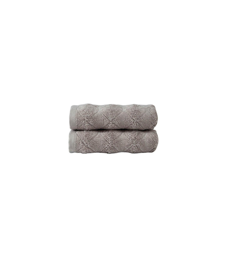 Stacked pair of taupe Turkish hand towels with geometric textured pattern
