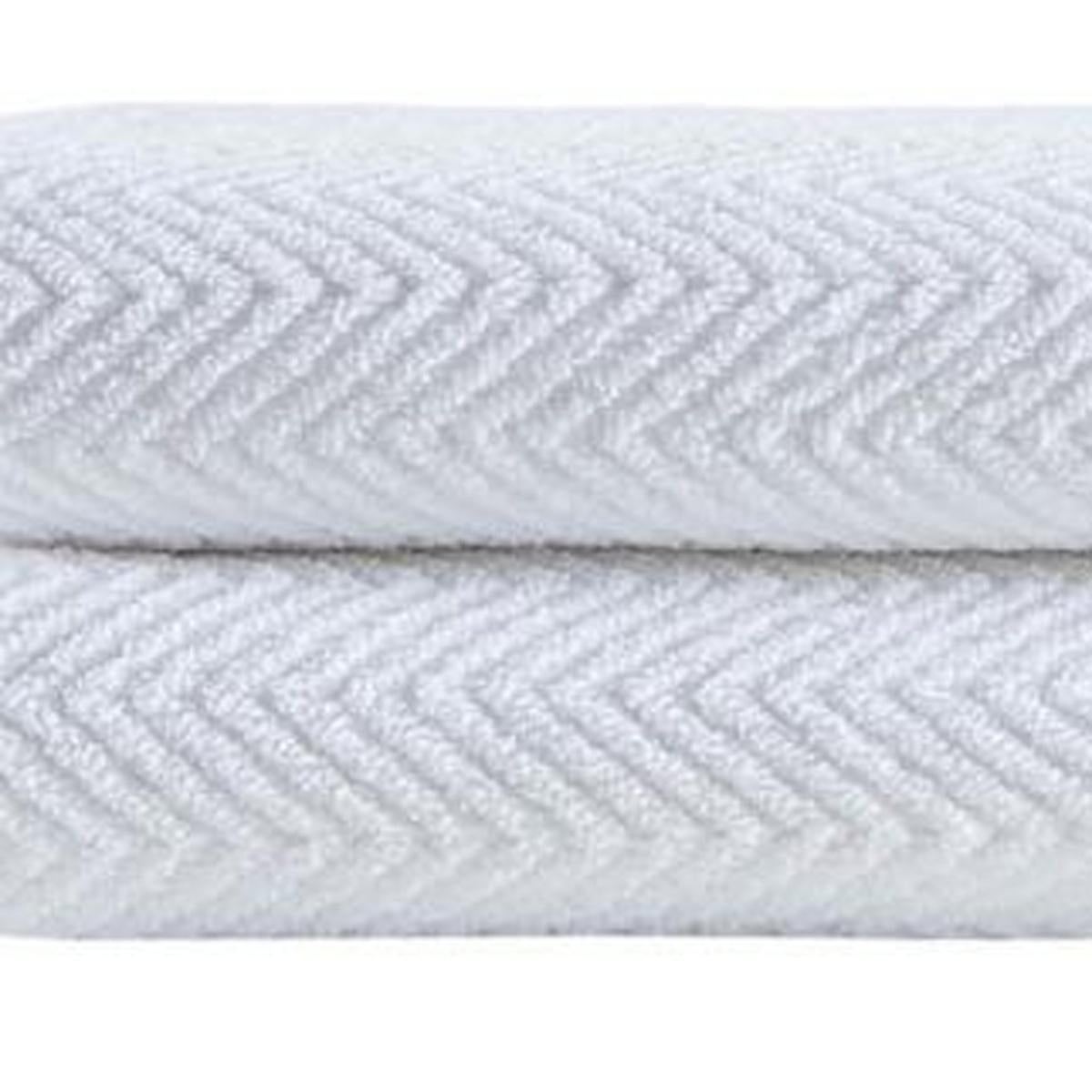 White chevron Turkish cotton bath towels, folded stack with textured weave