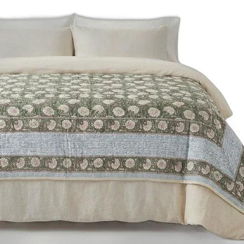 Cream cotton comforter close-up, green floral medallion stripe with coordinating border