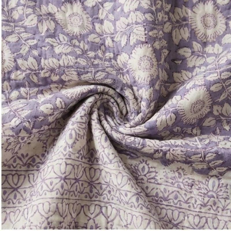 Lavender floral cotton comforter fabric with folded quilted seam detail