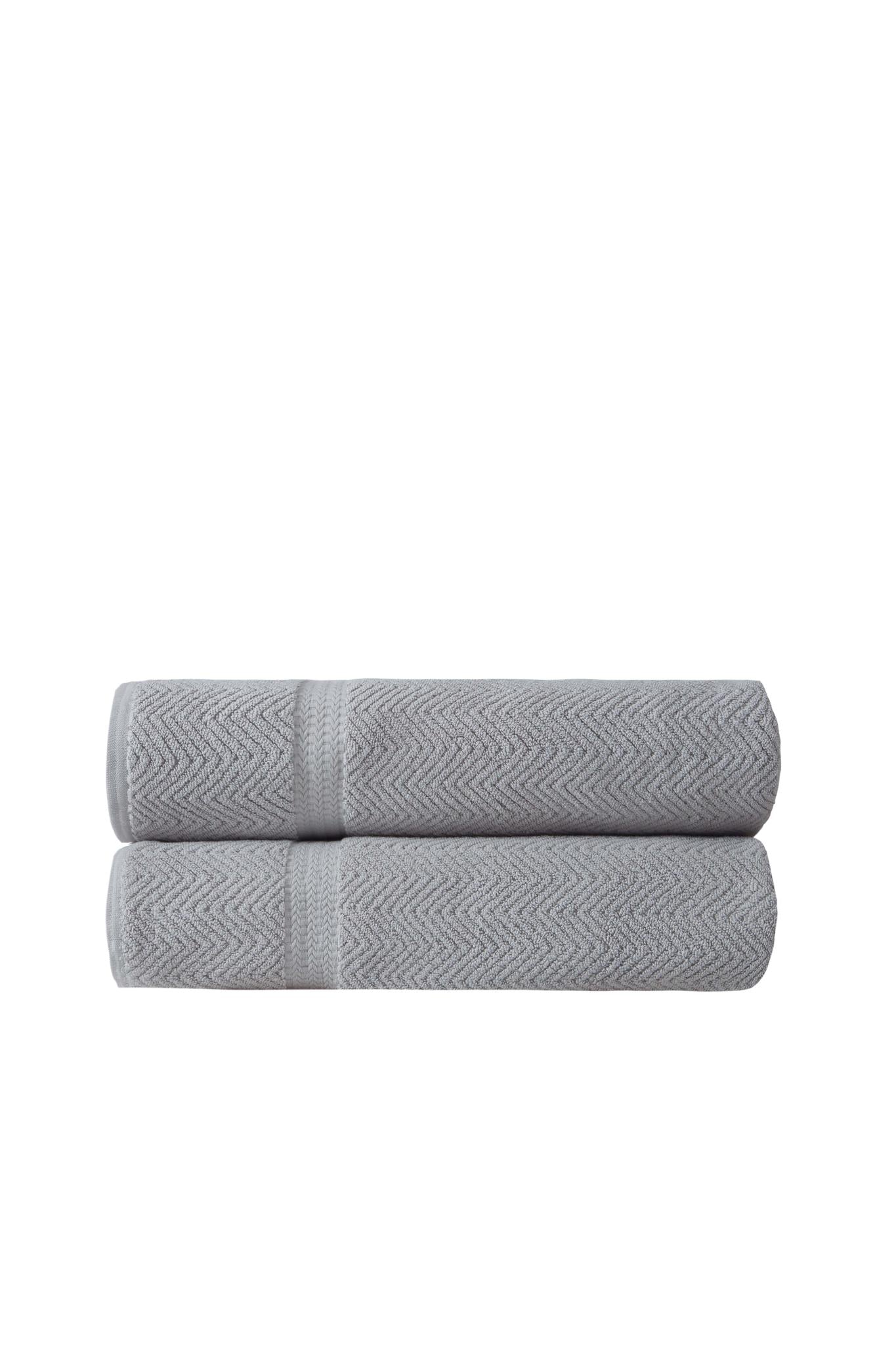 Set of two light gray chevron Turkish cotton bath sheets, neatly folded