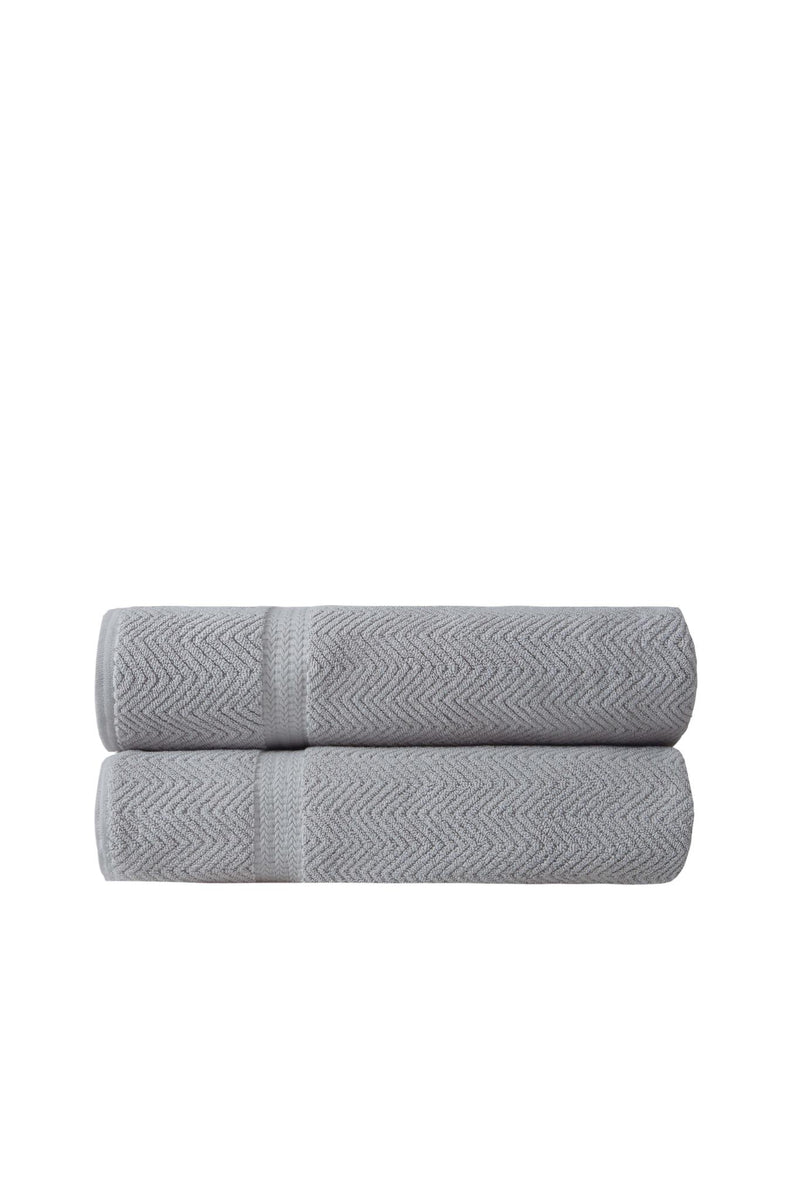 Set of two light gray chevron Turkish cotton bath sheets, neatly folded