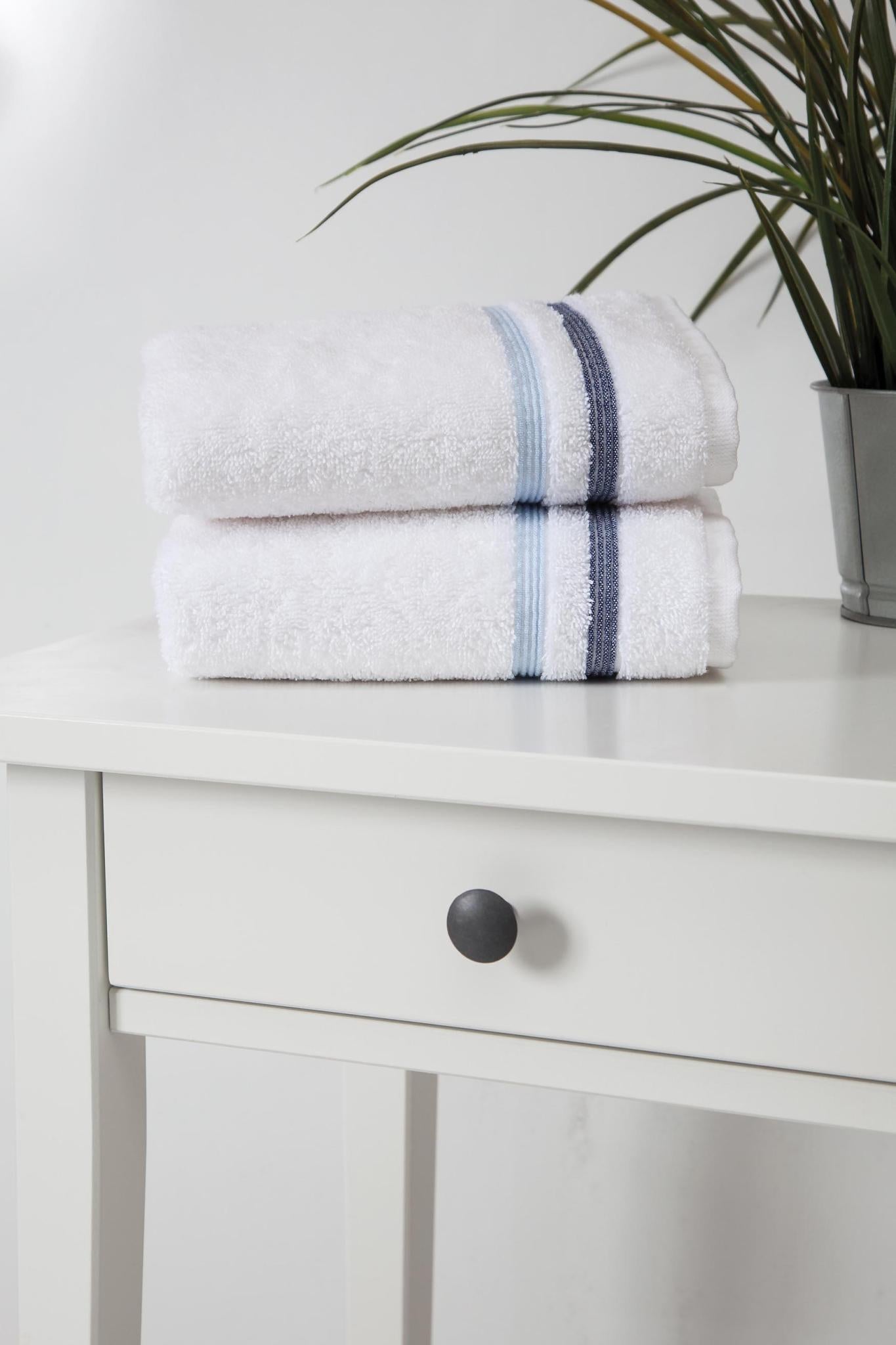 Set of two white Turkish cotton hand towels with blue stripe fold