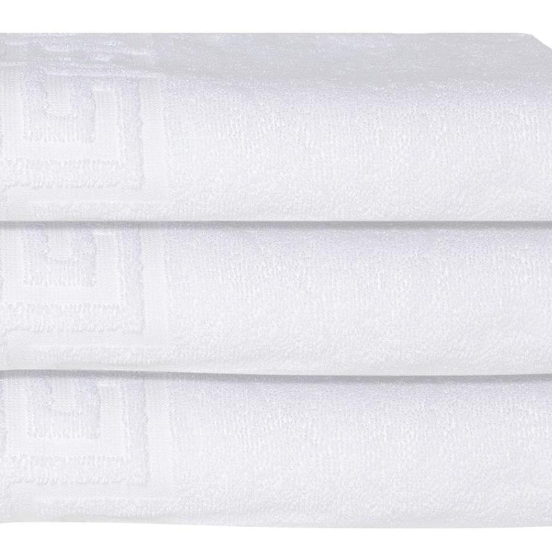 White Turkish cotton bath towel close-up of Greek key pattern across end border
