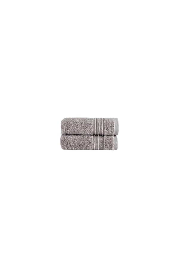 Two light brown Turkish cotton hand towels, folded with matching striped bands