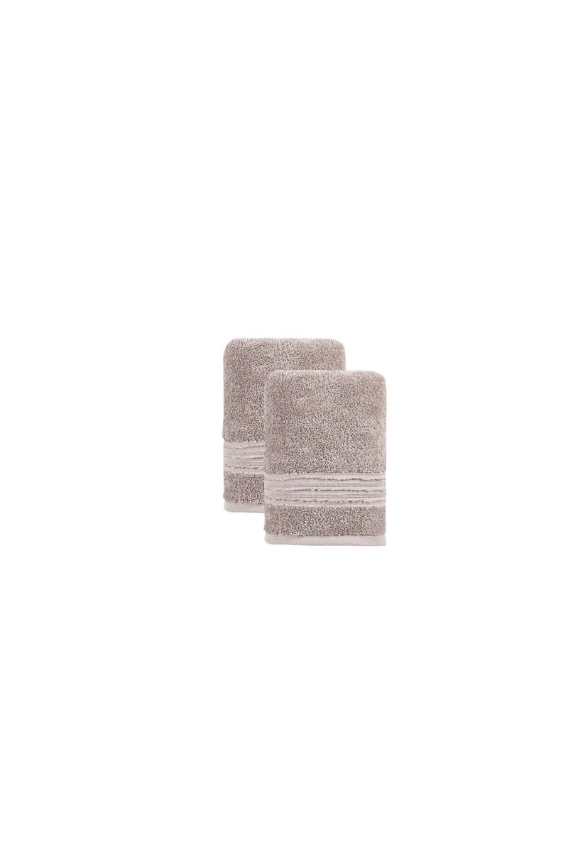 Two folded light brown Turkish hand towels with striped border banding